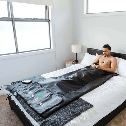 Man sleeping in Infrared Sauna Blanket